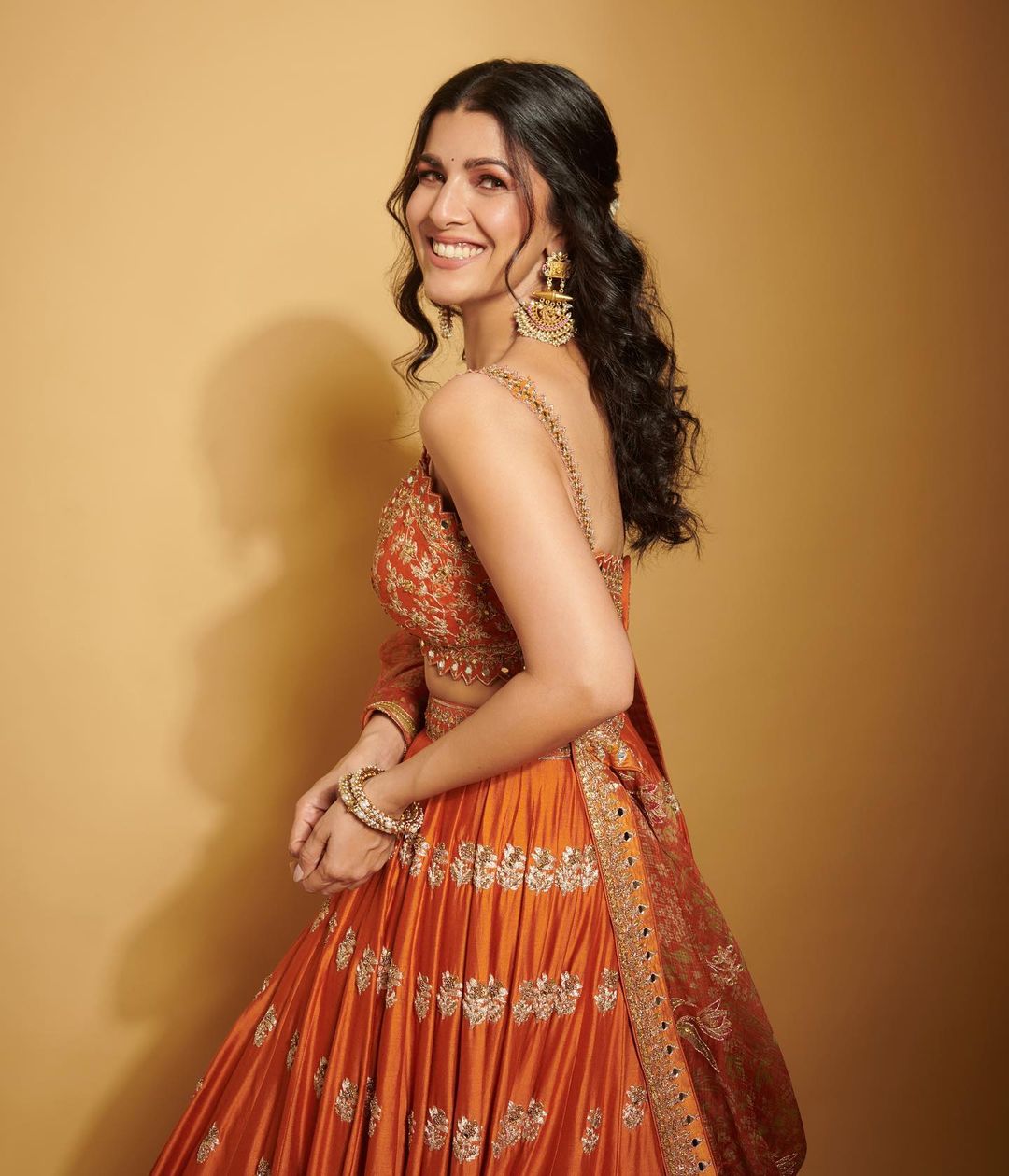 Bollywood Actress Nimrat Kaur Stills In Orange Lehenga Choli